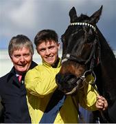 14 March 2023; Jockey Michael O'Sullivan and winning owner Barry Connell, left, celebrate in the winners enclosure after Marine Nationalehad won the Sky Bet Supreme Novices' Hurdle during day one of the Cheltenham Racing Festival at Prestbury Park in Cheltenham, England. Photo by Seb Daly/Sportsfile