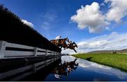 14 March 2023; Top Ville Ben, 14, with Thomas Dowson up, leads Harper's Brook, 20, with Tom Cannon up, over the water during the  Ultima Handicap Chase on day one of the Cheltenham Racing Festival at Prestbury Park in Cheltenham, England. Photo by Harry Murphy/Sportsfile