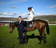 14 March 2023; Jockey Nico de Boinville celebrates on Constitution Hill, with handler Jaydon Lee after the Unibet Champion Hurdle Challenge Trophy during day one of the Cheltenham Racing Festival at Prestbury Park in Cheltenham, England. Photo by Harry Murphy/Sportsfile