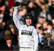 14 March 2023; Jockey Nico de Boinville celebrates as he is led into the winners enclosure after the Unibet Champion Hurdle Challenge Trophy during day one of the Cheltenham Racing Festival at Prestbury Park in Cheltenham, England. Photo by Harry Murphy/Sportsfile