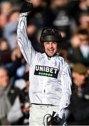 14 March 2023; Jockey Nico de Boinville celebrates as he is led into the winners enclosure after the Unibet Champion Hurdle Challenge Trophy during day one of the Cheltenham Racing Festival at Prestbury Park in Cheltenham, England.  Photo by Harry Murphy/Sportsfile
