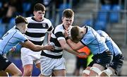 14 March 2023; Ryan Grant of Belvedere College  in action against Scott Barron, left, and Owen Twomey of St Michael's College during the Bank of Ireland Leinster Rugby Schools Junior Cup Semi Final match between Belvedere College and St Michael’s College at Energia Park in Dublin. Photo by Sam Barnes/Sportsfile