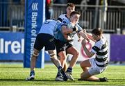 14 March 2023; Conor Canniffe of St Michael's College supported by team-mate Tom Reynolds, left, in action against Ryan Grant of Belvedere College during the Bank of Ireland Leinster Rugby Schools Junior Cup Semi Final match between Belvedere College and St Michael’s College at Energia Park in Dublin. Photo by Sam Barnes/Sportsfile