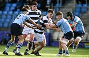 14 March 2023; Ryan Grant of Belvedere College  in action against, from left, Scott Barron, Owen Twomey and Myles Berman of St Michael's College during the Bank of Ireland Leinster Rugby Schools Junior Cup Semi Final match between Belvedere College and St Michael’s College at Energia Park in Dublin. Photo by Sam Barnes/Sportsfile
