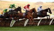 14 March 2023; Jazzy Matty, with Michael O'Sullivan up, jumps the last, ahead of number 5, Byker, with Philip Byrnes up, on their way to winning the Boodles Juvenile Handicap Hurdle during day one of the Cheltenham Racing Festival at Prestbury Park in Cheltenham, England. Photo by Seb Daly/Sportsfile