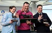 14 March 2023; Jockey Rachael Blackmore celebrates with owner Kenneth Alexander, and trainer Henry de Bromhead, right, after Honeysuckle won the Close Brothers Mares' Hurdle during day one of the Cheltenham Racing Festival at Prestbury Park in Cheltenham, England. Photo by Seb Daly/Sportsfile
