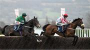 15 March 2023; The Real Whacker, right, with Sam Twiston-Davies up, jumps the last, first time around, on their way to winning the Brown Advisory Novices' Chase ahead of eventual third place Bronn, with Daryl Jacob up, during day two of the Cheltenham Racing Festival at Prestbury Park in Cheltenham, England. Photo by Harry Murphy/Sportsfile