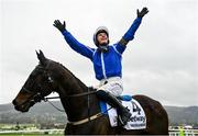 15 March 2023; Jockey Paul Townend celebrates on Energumene after winning the Betway Queen Mother Champion Chase during day two of the Cheltenham Racing Festival at Prestbury Park in Cheltenham, England. Photo by Seb Daly/Sportsfile