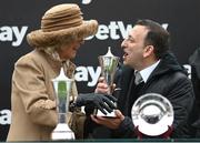 15 March 2023; Camilla, Queen Consort, presents owner Tony Bloom with his trophy after winning the Betway Queen Mother Champion Chase, with Energumene, on day two of the Cheltenham Racing Festival at Prestbury Park in Cheltenham, England. Photo by Harry Murphy/Sportsfile