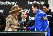 15 March 2023; Camilla, Queen Consort, presents a plate to jockey Paul Townend after winning the Betway Queen Mother Champion Chase, on Energumene, during day two of the Cheltenham Racing Festival at Prestbury Park in Cheltenham, England. Photo by Harry Murphy/Sportsfile