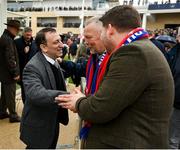 15 March 2023; Winner owner Tony Bloom, owner and chairman of Premier League football club Brighton & Hove Albion, who sent out Energumene to win the Betway Queen Mother Champion Chase, is congratulated by owners of fourth placed Editeur Du Gite, and Crystal Palace supporters, Steve and Sean Peston, on day two of the Cheltenham Racing Festival at Prestbury Park in Cheltenham, England. Photo by Seb Daly/Sportsfile
