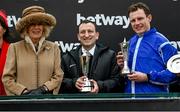 15 March 2023; Camilla, Queen Consort, with winning owner Tony Bloom and jockey Paul Townend after winning the Betway Queen Mother Champion Chase, with Energumene, during day two of the Cheltenham Racing Festival at Prestbury Park in Cheltenham, England. Photo by Harry Murphy/Sportsfile
