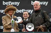 15 March 2023; Camilla, Queen Consort, presents the Betway Queen Mother Champion Chase winner trainers prize to Willie Mullins, after he sent out Energumene to won, on day two of the Cheltenham Racing Festival at Prestbury Park in Cheltenham, England. Photo by Harry Murphy/Sportsfile