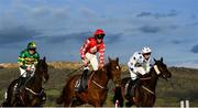 14 March 2023; Jazzy Matty, with Michael O'Sullivan up, centre, on their way to winning the Juvenile Handicap Hurdle alongside eventual second placed Byker, with Philip Byrnes up, left, and third placed Risk Belle, with Luke Dempsey up, during day one of the Cheltenham Racing Festival at Prestbury Park in Cheltenham, England. Photo by Harry Murphy/Sportsfile