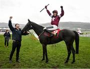 15 March 2023; Jockey Keith Donoghue and groom Darren Treacy celebrate with Delta Work after winning the Glenfarclas Cross Country Chase during day two of the Cheltenham Racing Festival at Prestbury Park in Cheltenham, England. Photo by Seb Daly/Sportsfile