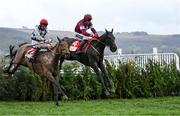 15 March 2023; Delta Work, with Keith Donoghue up, jumps the last ahead of second placed Galvin, with Davy Russell up, on their way to winning the Glenfarclas Cross Country Chase on day two of the Cheltenham Racing Festival at Prestbury Park in Cheltenham, England. Photo by Harry Murphy/Sportsfile