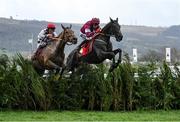 15 March 2023; Delta Work, with Keith Donoghue up, jumps the last ahead of second placed Galvin, with Davy Russell up, on their way to winning the Glenfarclas Cross Country Chase on day two of the Cheltenham Racing Festival at Prestbury Park in Cheltenham, England. Photo by Harry Murphy/Sportsfile