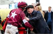 15 March 2023; Jockey Keith Donoghue is congratulated by trainer Gordon Elliott after winning the Glenfarclas Cross Country Chase, on Delta Work, on day two of the Cheltenham Racing Festival at Prestbury Park in Cheltenham, England. Photo by Harry Murphy/Sportsfile