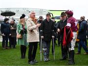 15 March 2023; Owner Michael O'Leary, left, injured jockey Jack Kennedy, Eddie O'Leary, manager of Gigginstown House Stud, and jockey Keith Donoghue, after winning the Glenfarclas Cross Country Chase, with Delta Work, on day two of the Cheltenham Racing Festival at Prestbury Park in Cheltenham, England. Photo by Harry Murphy/Sportsfile