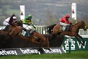 15 March 2023; Maskada, with Darragh O'Keeffe up, right, jumps the last on their way the Johnny Henderson Grand Annual Challenge Cup Handicap Chase, ahead of second placed Dinoblue, with Luke Dempsey up, 18, on day two of the Cheltenham Racing Festival at Prestbury Park in Cheltenham, England. Photo by Harry Murphy/Sportsfile