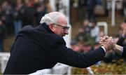 15 March 2023; Brian Gleeson, father of jockey John Gleeson and former owner of A Dream To Share, celebrates after his son won the Weatherbys Champion Bumper onboard A Dream To Share during day two of the Cheltenham Racing Festival at Prestbury Park in Cheltenham, England. Photo by Seb Daly/Sportsfile