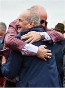 16 March 2023; Winning owner Niall Reilly, left, and trainer Tony Martin celebrate after they had won the Pertemps Network Final Handicap Hurdle during day three of the Cheltenham Racing Festival at Prestbury Park in Cheltenham, England. Photo by Seb Daly/Sportsfile