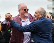 16 March 2023; Winning owner Niall Reilly, left, and trainer Tony Martin celebrate after they had won the Pertemps Network Final Handicap Hurdle during day three of the Cheltenham Racing Festival at Prestbury Park in Cheltenham, England. Photo by Seb Daly/Sportsfile