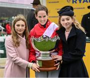 16 March 2023; Jockey Rachael Blackmore and daughters of winning trainer, Mia and Georgia de Bromhead celebrate, with the trophy, after winning the Ryanair Chase with Envoi Allen during day three of the Cheltenham Racing Festival at Prestbury Park in Cheltenham, England. Photo by Seb Daly/Sportsfile