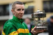 16 March 2023; Jockey Mark Walsh with the trophy after winning the Paddy Power Stayers' Hurdle on Sire Du Berlais  during day three of the Cheltenham Racing Festival at Prestbury Park in Cheltenham, England. Photo by Harry Murphy/Sportsfile