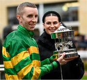16 March 2023; Jockey Mark Walsh and his partner Katie Young with the trophy after winning the Paddy Power Stayers' Hurdle on Sire Du Berlais during day three of the Cheltenham Racing Festival at Prestbury Park in Cheltenham, England. Photo by Harry Murphy/Sportsfile