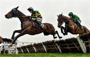 16 March 2023; Sire Du Berlais, left, with Mark Walsh up, jumps the last during the first circuit on their way to winning the Paddy Power Stayers' Hurdle during day three of the Cheltenham Racing Festival at Prestbury Park in Cheltenham, England. Photo by Seb Daly/Sportsfile