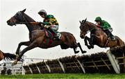 16 March 2023; Sire Du Berlais, left, with Mark Walsh up, jumps the last during the first circuit on their way to winning the Paddy Power Stayers' Hurdle during day three of the Cheltenham Racing Festival at Prestbury Park in Cheltenham, England. Photo by Seb Daly/Sportsfile