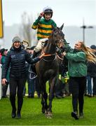 16 March 2023; Jockey Mark Walsh and Sire Du Berlais are led into the winners enclosure by Camilla Sharples, left, and groomer Elise Elliott after winning the Paddy Power Stayers' Hurdle during day three of the Cheltenham Racing Festival at Prestbury Park in Cheltenham, England. Photo by Seb Daly/Sportsfile