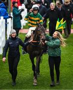 16 March 2023; Jockey Mark Walsh and Sire Du Berlais are led into the winners enclosure by Camilla Sharples, left, and groomer Elise Elliott after winning the Paddy Power Stayers' Hurdle during day three of the Cheltenham Racing Festival at Prestbury Park in Cheltenham, England. Photo by Harry Murphy/Sportsfile