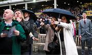 16 March 2023; Punters watch the early stages of the Jack De Bromhead Mares' Novices' Hurdle during day three of the Cheltenham Racing Festival at Prestbury Park in Cheltenham, England. Photo by Harry Murphy/Sportsfile