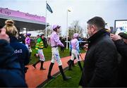 16 March 2023; Jockeys, including Jack Andres, centre, make their way to the parade ring prior to the start of the Fulke Walwyn Kim Muir Challenge Cup Amateur Jockeys' Handicap Chase during day three of the Cheltenham Racing Festival at Prestbury Park in Cheltenham, England. Photo by Harry Murphy/Sportsfile