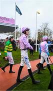 16 March 2023; Jockeys, including Jack Andres, centre, make their way to the parade ring prior to the start of the Fulke Walwyn Kim Muir Challenge Cup Amateur Jockeys' Handicap Chase during day three of the Cheltenham Racing Festival at Prestbury Park in Cheltenham, England. Photo by Harry Murphy/Sportsfile