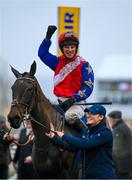 16 March 2023; Groom Corina Bowe leads Angels Dawn and jockey Mr P A King after they had won the Fulke Walwyn Kim Muir Challenge Cup Amateur Jockeys' Handicap Chase during day three of the Cheltenham Racing Festival at Prestbury Park in Cheltenham, England. Photo by Seb Daly/Sportsfile