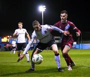 16 March 2023; Cameron Elliott of Dundalk in action against Evan Weir of Drogheda United during the SSE Airtricity Men's Premier Division match between Drogheda United and Dundalk at Weavers Park in Drogheda, Louth. Photo by Stephen McCarthy/Sportsfile