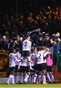 16 March 2023; Dundalk players celebrate with supporters after Connor Malley scored their first goal during the SSE Airtricity Men's Premier Division match between Drogheda United and Dundalk at Weavers Park in Drogheda, Louth. Photo by Stephen McCarthy/Sportsfile