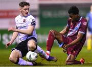 16 March 2023; John Martin of Dundalk is tackled by Elicha Ahui of Drogheda United during the SSE Airtricity Men's Premier Division match between Drogheda United and Dundalk at Weavers Park in Drogheda, Louth. Photo by Stephen McCarthy/Sportsfile