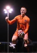 16 March 2023; Dundalk goalkeeper Nathan Shepperd is lifted by team-mate Mark Byrne in celebration after the SSE Airtricity Men's Premier Division match between Drogheda United and Dundalk at Weavers Park in Drogheda, Louth. Photo by Stephen McCarthy/Sportsfile