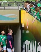 17 March 2023; Jonathan Sexton greets his wife Laura, and children Luca, Sophie, and Amy, before the Ireland rugby captain's run at the Aviva Stadium in Dublin. Photo by Ramsey Cardy/Sportsfile