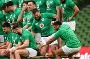 17 March 2023; Bundee Aki, right, is picked up by Andrew Porter after falling from the bench during the Ireland rugby captain's run at the Aviva Stadium in Dublin. Photo by Ramsey Cardy/Sportsfile