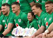 17 March 2023; Ireland players, from right, Tadhg Furlong, Josh van der Flier, Jonathan Sexton and Peter O’Mahony, sit with Ireland supporter Jennifer Malone, in aid of the 'Lots of Socks' campaign during the Ireland rugby captain's run at the Aviva Stadium in Dublin. Photo by Ramsey Cardy/Sportsfile