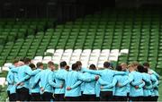 17 March 2023; The England team huddle during England rugby captain's run at the Aviva Stadium in Dublin. Photo by Ramsey Cardy/Sportsfile