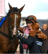 17 March 2023; Jockey Bridget Andrews celebrates with groom Grace Davies after Faivoir was led into the winners enclosure after the McCoy Contractors County Handicap Hurdle during day four of the Cheltenham Racing Festival at Prestbury Park in Cheltenham, England. Photo by Seb Daly/Sportsfile Photo by Harry Murphy/Sportsfile