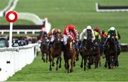 17 March 2023; Jockey Bridget Andrews on Faivoir, left, as they pass Pied Piper, with Davy Russell up, to win the McCoy Contractors County Handicap Hurdle during day four of the Cheltenham Racing Festival at Prestbury Park in Cheltenham, England. Photo by Seb Daly/Sportsfile