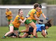 17 March 2023; Eilish O'Dowd of Dublin in action against Donegal players, from left, Roisin Rodgers, Katie Dowds and Shelly Twohig during the Lidl Ladies National Football League Division 1 match between Donegal and Dublin at O’Donnell Park in Letterkenny, Donegal. Photo by Stephen McCarthy/Sportsfile