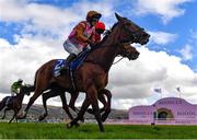 17 March 2023; Jockey Bridget Andrews on Faivoir, reacts as they beat Pied Piper, with Davy Russell up, on the field to win the McCoy Contractors County Handicap Hurdle during day four of the Cheltenham Racing Festival at Prestbury Park in Cheltenham, England. Photo by Seb Daly/Sportsfile